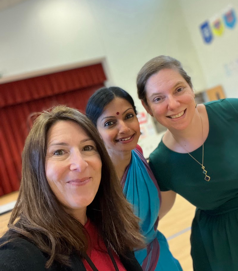 Three women at elementary school Indian Dance workshop