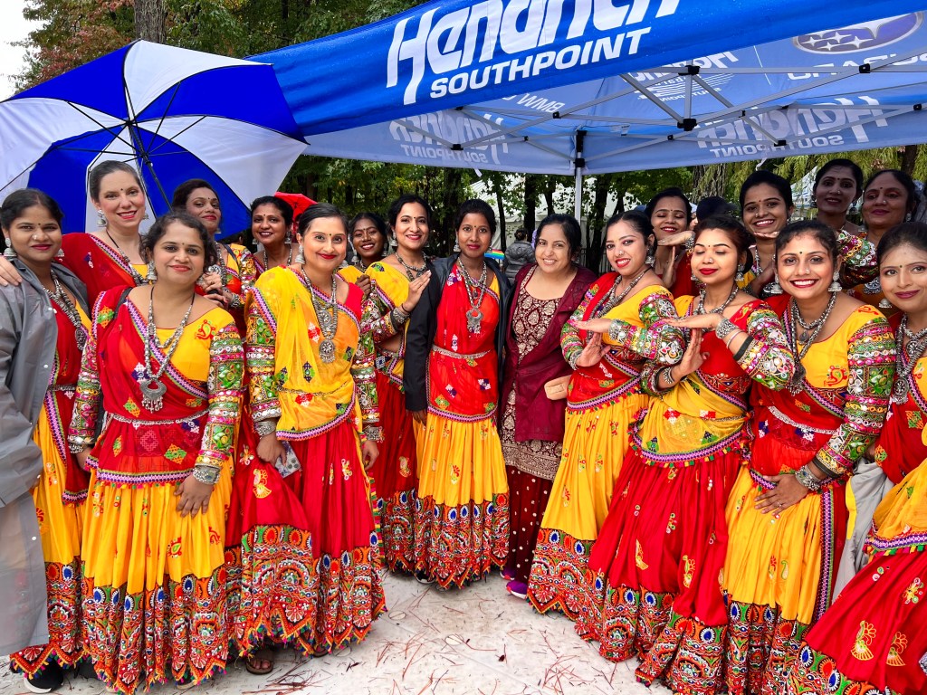 Dance group in brightly colored dresses
