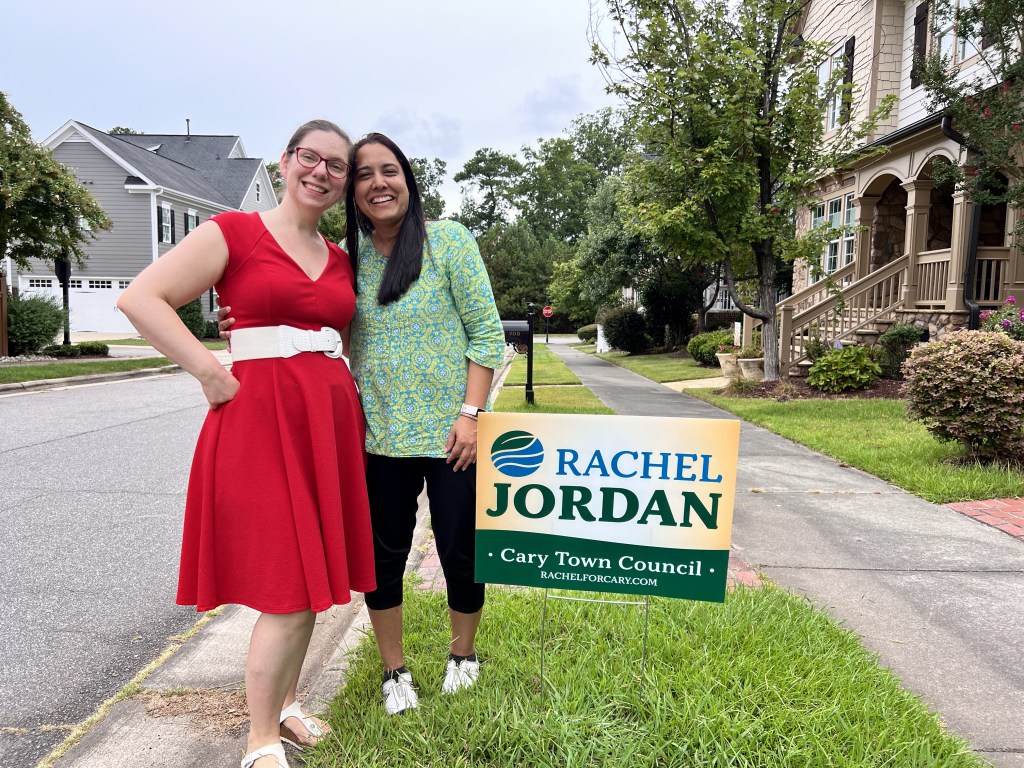 Rachel Jordan with Amita Gupta next to a Rachel Jordan for Cary election sign.